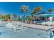 Resort-style pool with lounge chairs and a shaded bar area at 3937 Lana Ave, Davenport, FL 33897