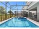 Enjoy this refreshing screened pool and spa at 3937 Lana Ave, Davenport, FL 33897
