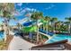 Dual water slides at a resort with a walkway and landscaping at 3937 Lana Ave, Davenport, FL 33897