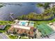 Aerial view of clubhouse, pool, and tennis courts at 423 Harbourview Dr, Haines City, FL 33844