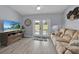 Relaxing Gathering room with French doors leading to patio at 423 Harbourview Dr, Haines City, FL 33844