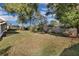 Spacious backyard with lush grass and mature trees at 5011 Winwood Way, Orlando, FL 32819