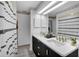 Bathroom with double vanity and black and white decor at 5011 Winwood Way, Orlando, FL 32819