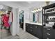 Bathroom with double vanity, walk-in closet, and gold accents at 5011 Winwood Way, Orlando, FL 32819