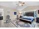 Bright bedroom featuring a king-size bed and wood flooring at 5011 Winwood Way, Orlando, FL 32819