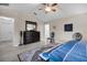 Spacious bedroom with large bed, dresser, and ceiling fan at 5011 Winwood Way, Orlando, FL 32819