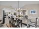 Formal dining room with a large table, chandelier, and hardwood floors at 5011 Winwood Way, Orlando, FL 32819
