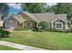 Attractive one-story home with landscaped yard and attached garage at 5011 Winwood Way, Orlando, FL 32819