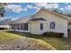 Well-maintained house exterior with screened porch and landscaping at 5011 Winwood Way, Orlando, FL 32819