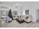 Comfortable living room featuring a neutral color palette and a cozy seating arrangement at 5011 Winwood Way, Orlando, FL 32819