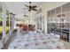 Bright screened porch with table and chairs, overlooking the backyard at 5011 Winwood Way, Orlando, FL 32819