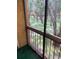 Screened balcony overlooking a lush, wooded area at 5291 Images Cir # 204, Kissimmee, FL 34746