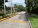 Gated community entrance with signage and security features at 5291 Images Cir # 204, Kissimmee, FL 34746