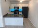 Modern kitchen with black appliances and granite counters at 5291 Images Cir # 204, Kissimmee, FL 34746