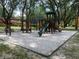 playground with swings, slide, and climbing structure at 5291 Images Cir # 204, Kissimmee, FL 34746