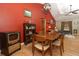 Cozy dining room features wood table and chairs and an accent wall at 7276 Abbey Ln, Winter Park, FL 32792