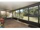 Covered screened porch with view of the backyard at 7276 Abbey Ln, Winter Park, FL 32792