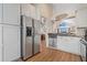 Modern kitchen with stainless steel appliances and white cabinets at 984 Summer Lakes Dr, Orlando, FL 32835