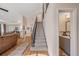 Modern staircase with gray carpet and half bath at 984 Summer Lakes Dr, Orlando, FL 32835