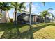 Screened patio and spacious backyard with lush landscaping at 1108 Darnaby Way, Orlando, FL 32824