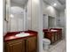 Bathroom featuring double vanity, tile flooring, shower and open access to another room at 1108 Darnaby Way, Orlando, FL 32824