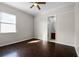 This room has hardwood floors, natural light, and neutral paint colors at 1108 Darnaby Way, Orlando, FL 32824