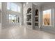 Spacious living room with high ceilings, large windows, and built-in shelving at 1108 Darnaby Way, Orlando, FL 32824