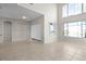 Bright living room features tile floors, high ceilings, and large windows at 1108 Darnaby Way, Orlando, FL 32824