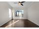 Bright living room featuring hardwood floors and large windows with a view at 1108 Darnaby Way, Orlando, FL 32824