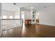 Upstairs loft area with hardwood floors and a built-in desk and cabinet area at 1108 Darnaby Way, Orlando, FL 32824
