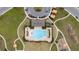 Aerial view of community pool, surrounding recreational areas, and playground at 1213 Red Hill Rd, Davenport, FL 33837