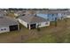 Aerial view of house showcasing backyard and neighborhood at 1213 Red Hill Rd, Davenport, FL 33837