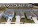 Aerial view of homes near a pond at 1213 Red Hill Rd, Davenport, FL 33837