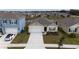 One-story house next to a lake in a new community at 1213 Red Hill Rd, Davenport, FL 33837