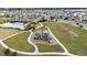 Aerial view showing community pool, playground, and surrounding homes at 1213 Red Hill Rd, Davenport, FL 33837