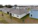 House with backyard and surrounding homes visible from above at 1213 Red Hill Rd, Davenport, FL 33837