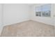 Bright bedroom featuring neutral wall and carpet at 1213 Red Hill Rd, Davenport, FL 33837