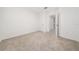 Simple bedroom with neutral carpet and white walls at 1213 Red Hill Rd, Davenport, FL 33837