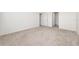 Spacious bedroom with neutral carpeting and ample closet space at 1213 Red Hill Rd, Davenport, FL 33837