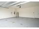 Finished garage with epoxy flooring and extra storage at 1213 Red Hill Rd, Davenport, FL 33837