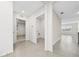 Hallway with tile floors and doors to bedrooms and laundry at 1213 Red Hill Rd, Davenport, FL 33837