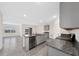 Kitchen with gray cabinets, granite countertops, and stainless steel appliances at 1213 Red Hill Rd, Davenport, FL 33837