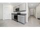 Kitchen with gray cabinets, granite countertops, and stainless steel appliances at 1213 Red Hill Rd, Davenport, FL 33837
