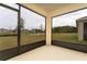 Relaxing screened porch overlooking a pond and conservation at 1213 Red Hill Rd, Davenport, FL 33837