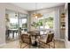 Bright breakfast nook with a round table and access to the backyard at 13672 Fresh Ivy St, Winter Garden, FL 34787