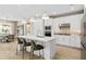Modern kitchen with white cabinets, center island, and stainless steel appliances at 13672 Fresh Ivy St, Winter Garden, FL 34787
