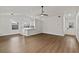 Spacious living area features light wood flooring and a ceiling fan at 1395 Kenneth Ave, Casselberry, FL 32707