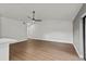 Bright and airy living room with wood-look flooring and a ceiling fan at 1395 Kenneth Ave, Casselberry, FL 32707