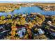 Aerial view highlighting a single Gathering home near a lake at 1642 Athens St, Lakeland, FL 33803