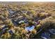 An aerial view of a home amongst other houses near a lake at 1642 Athens St, Lakeland, FL 33803